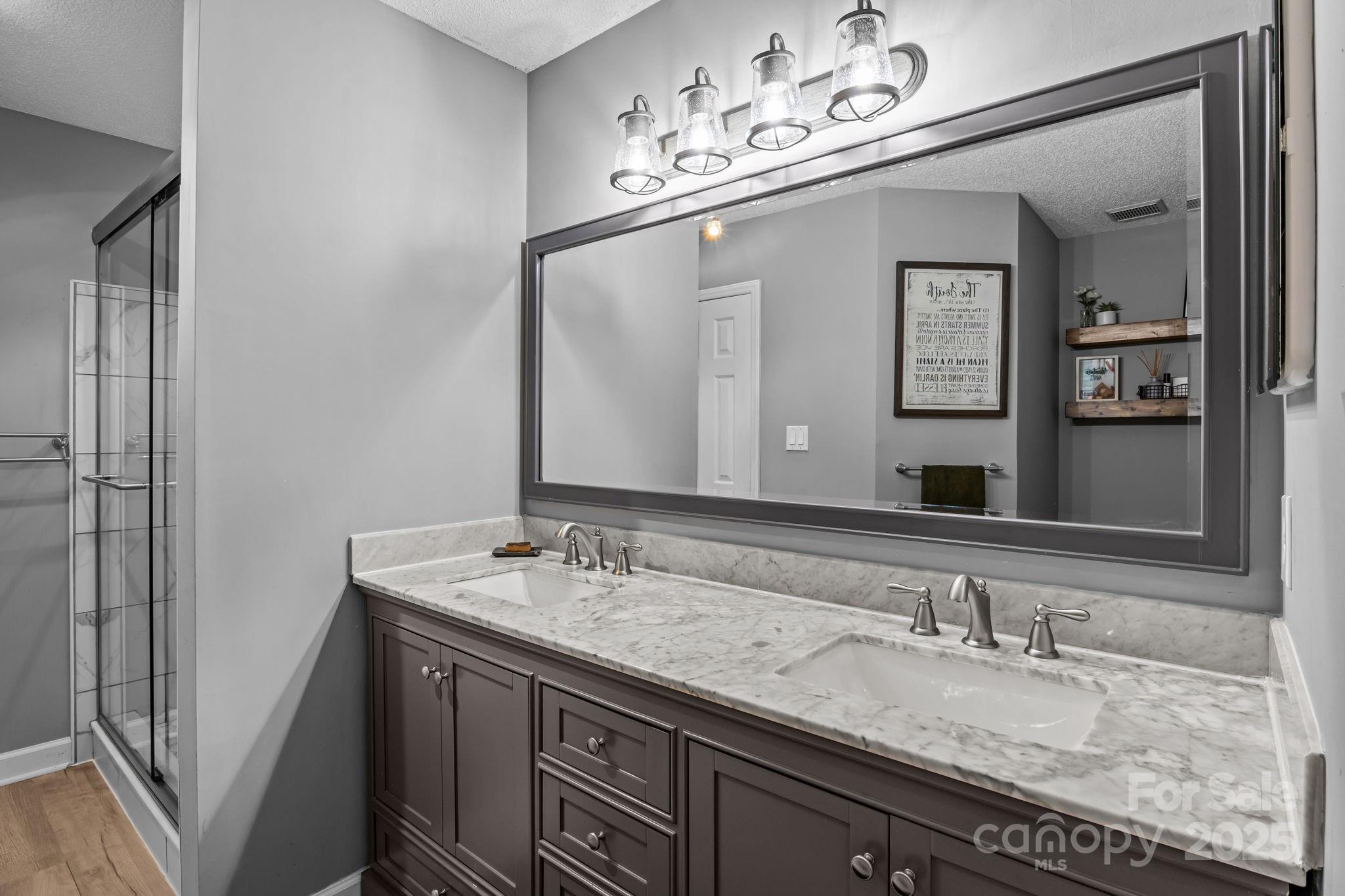 7229 Catawba Springs Road Denver, NC 28037 - Photo 28 of 48 a bathroom with a sink and a mirror