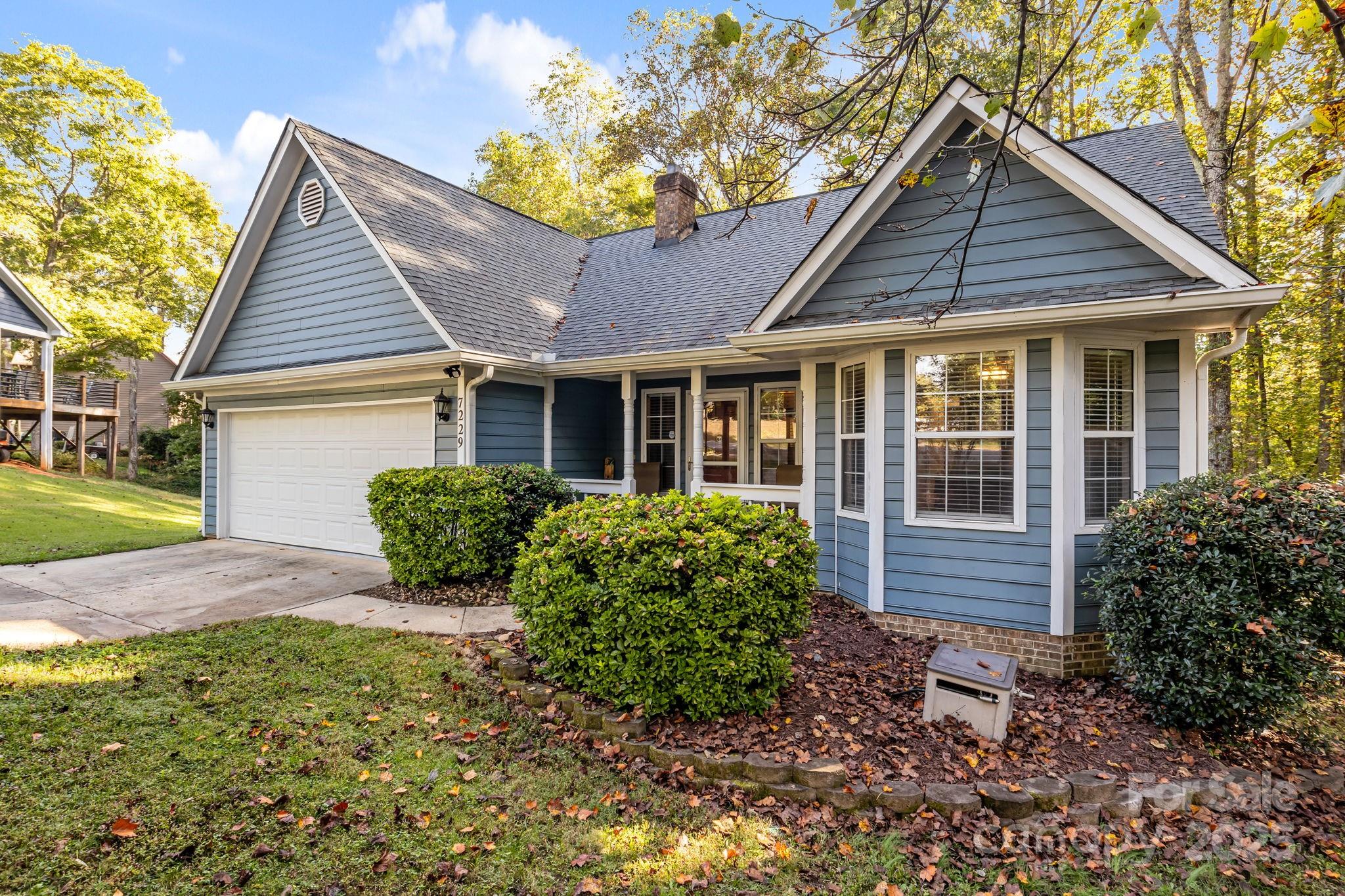 7229 Catawba Springs Road Denver, NC 28037 - Photo 3 of 48 a front view of a house with garden