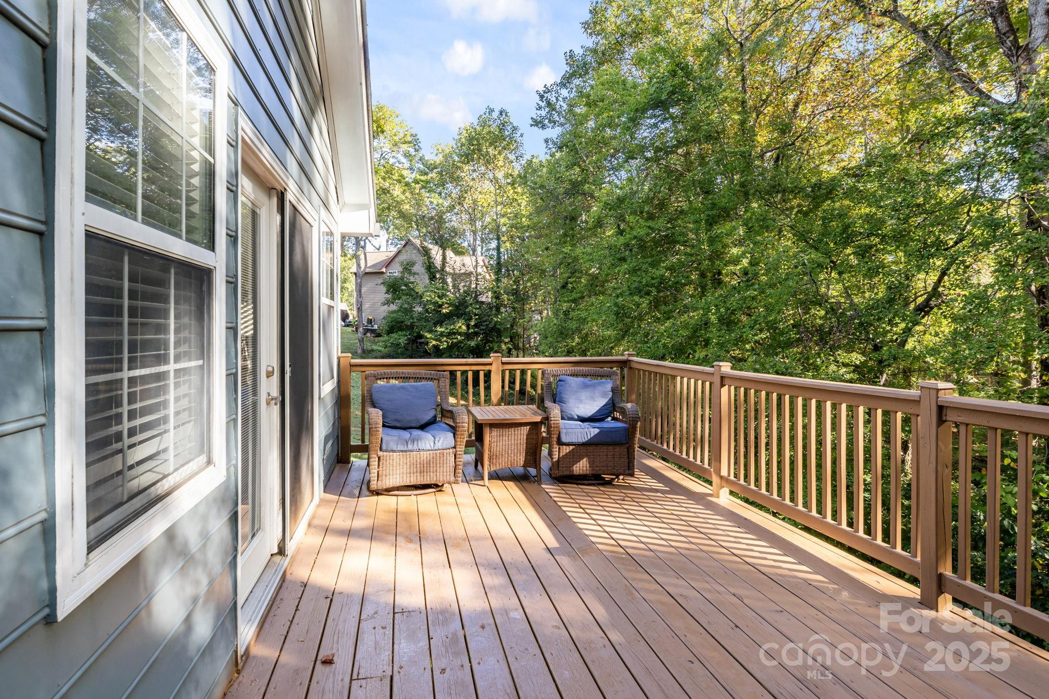 7229 Catawba Springs Road Denver, NC 28037 - Photo 35 of 48 a view of a balcony with chairs and wooden floor