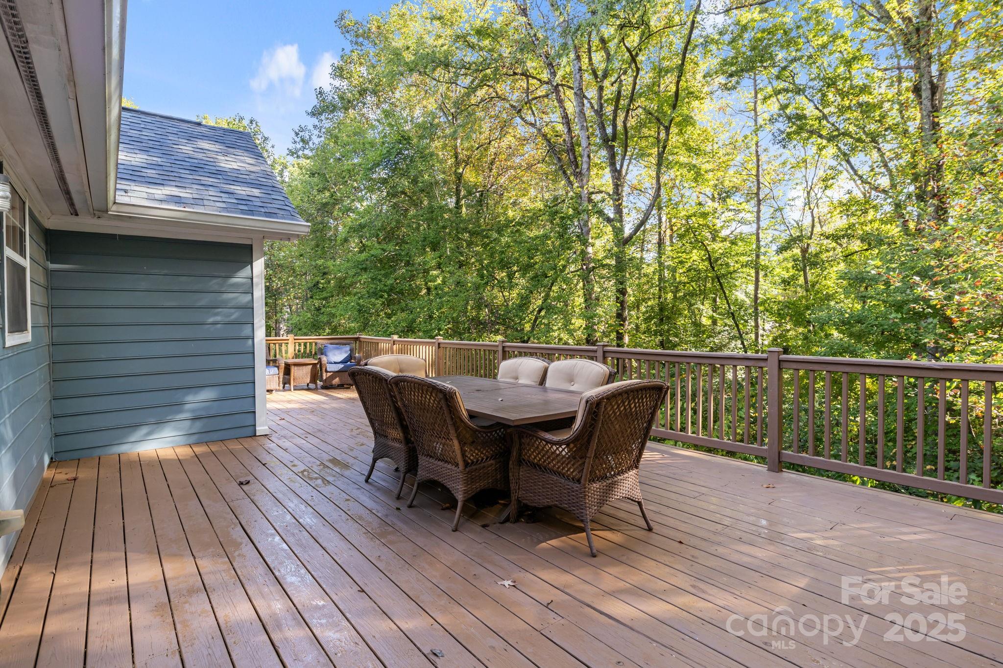 7229 Catawba Springs Road Denver, NC 28037 - Photo 36 of 48 a view of a roof deck with table and chairs with wooden floor and fence