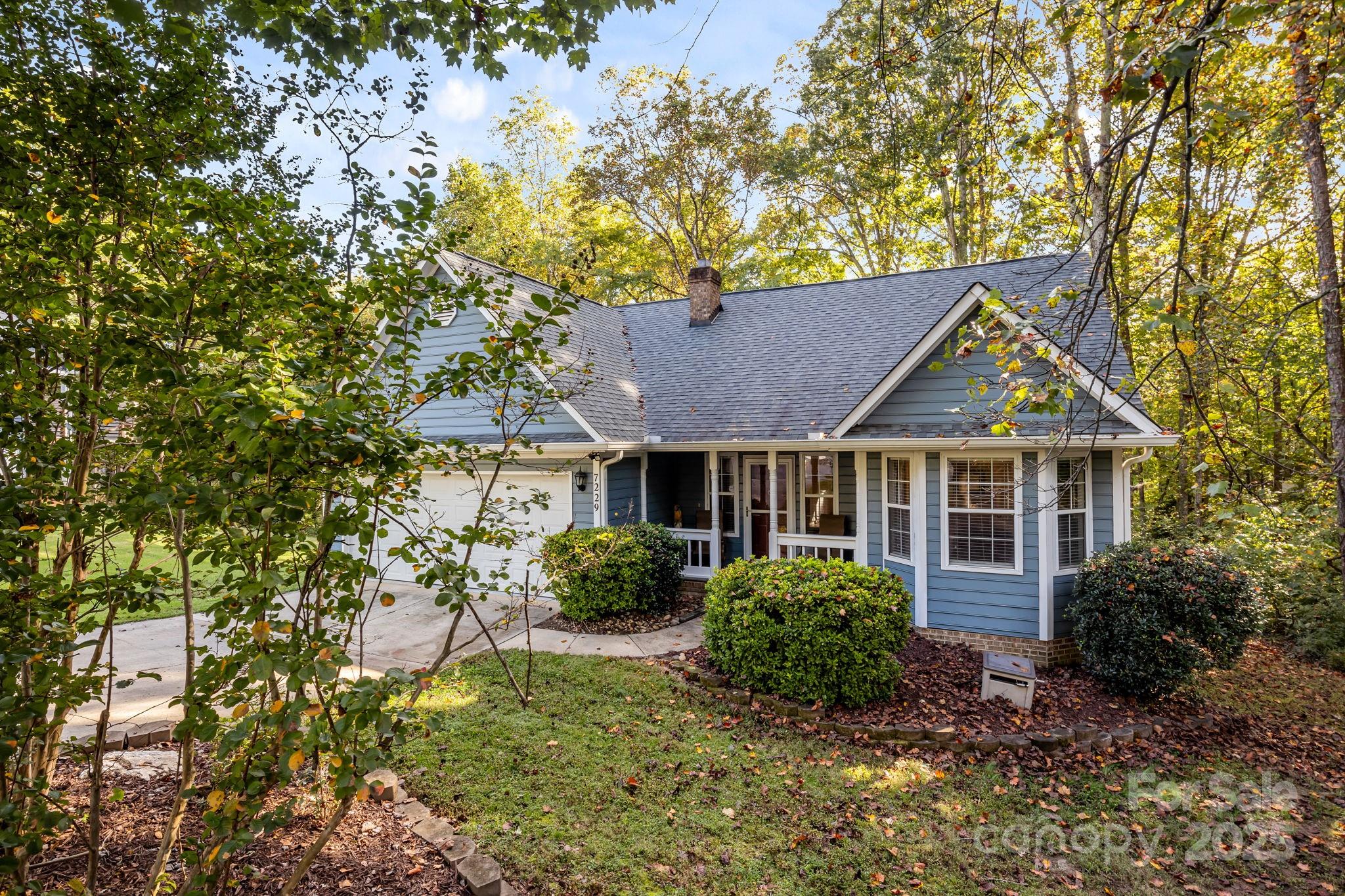7229 Catawba Springs Road Denver, NC 28037 - Photo 5 of 48 a view of a house with a tree in front of it