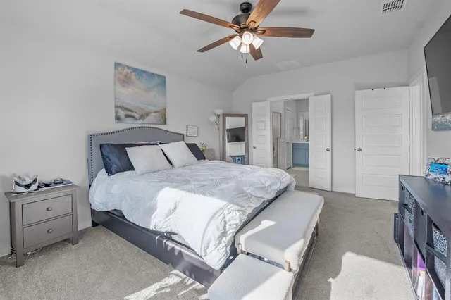 a spacious bathroom with a granite countertop sink mirror and a shower