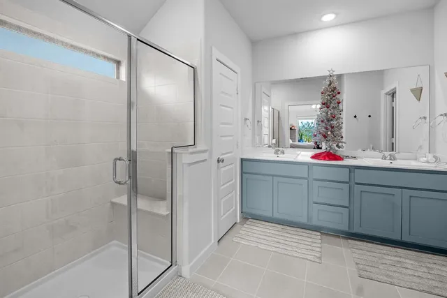 a view of walk in closet with clothes