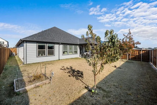 a house view with a sitting space and wooden fence