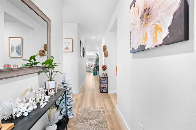 a kitchen with stainless steel appliances kitchen island granite countertop a table chairs refrigerator a sink and dishwasher