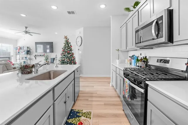 a dining room with furniture and wooden floor
