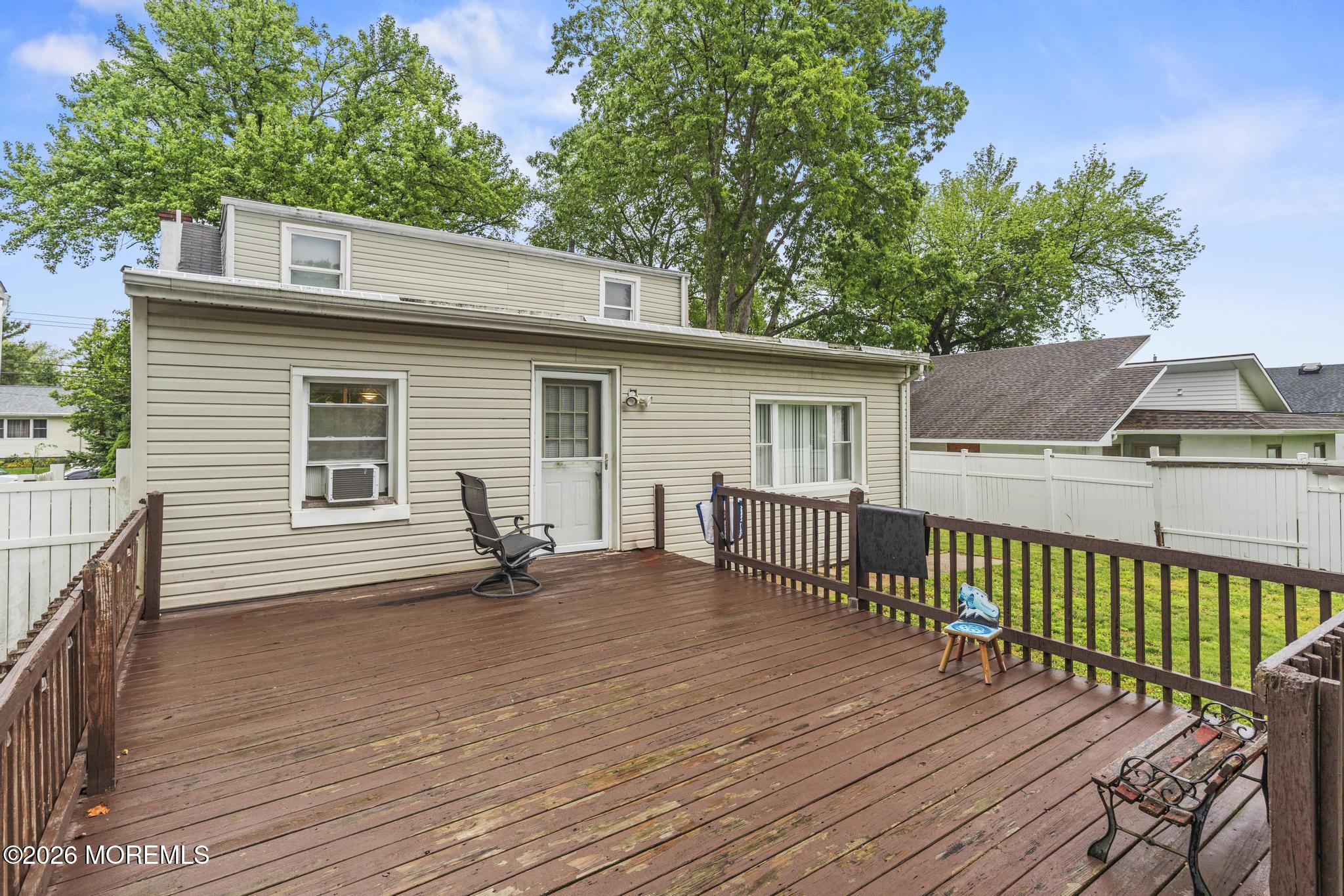 1914 Rutherford Avenue Neptune Township, NJ 07753 - Photo 21 of 25 a view of a house with a wooden deck