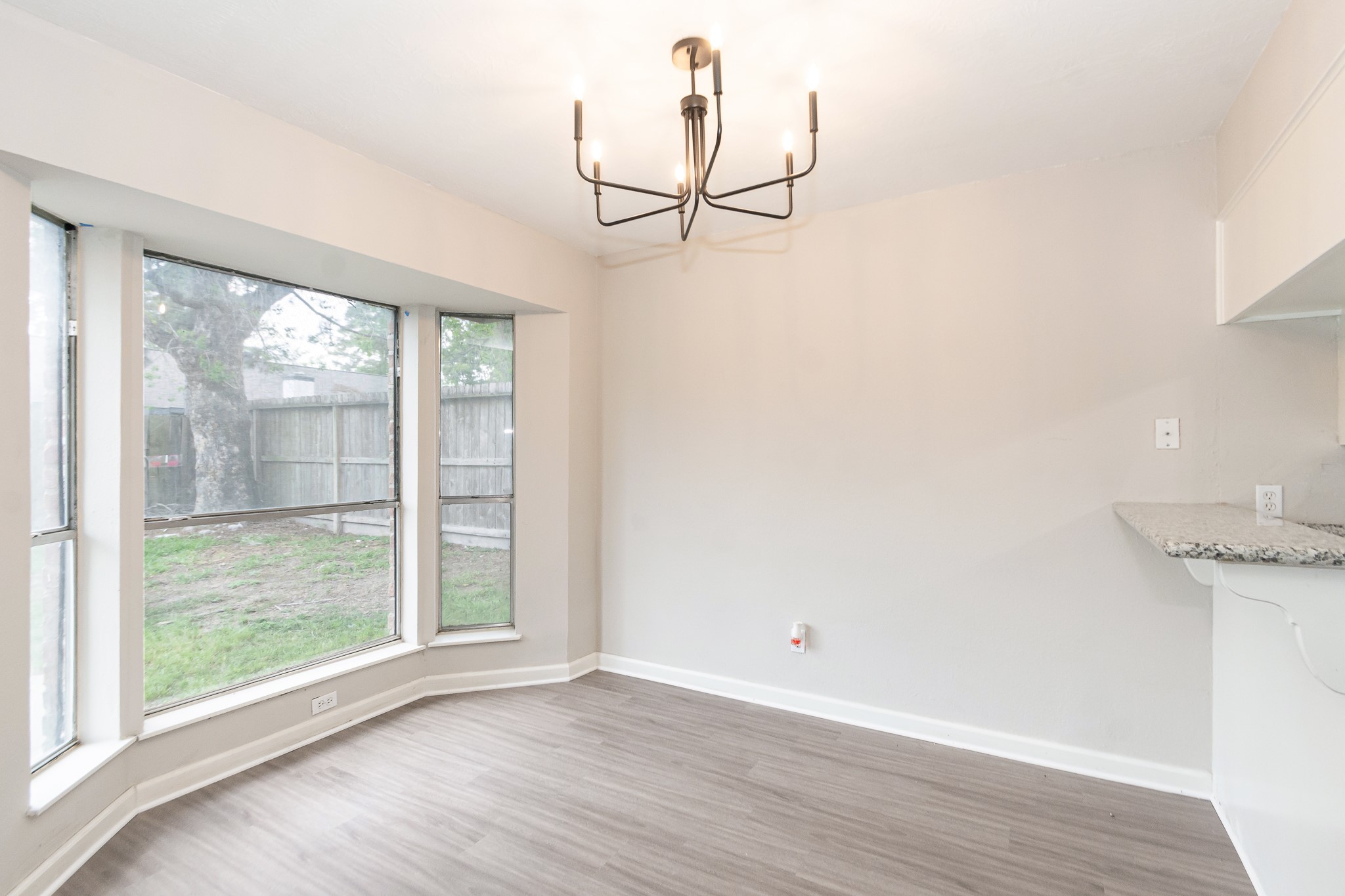 29019 Stapleford Street Spring, TX 77386 - Photo 7 of 27 a view of empty room with wooden floor and fan