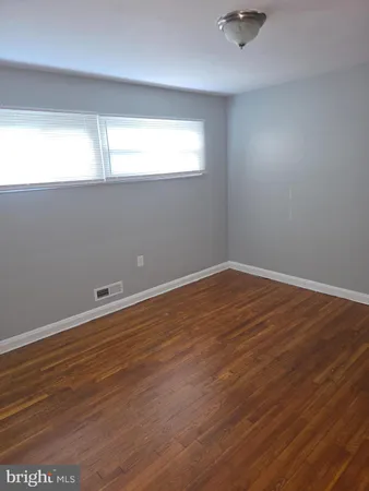 a bathroom with a toilet and a bath tub