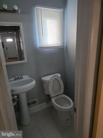 a kitchen with granite countertop a stove and a refrigerator