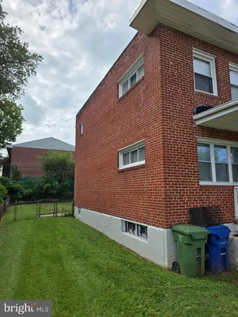 a brick building with a yard