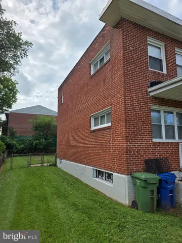 a brick building with a yard