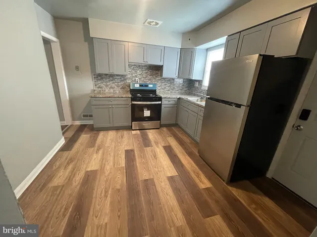 a kitchen with a refrigerator a sink and dishwasher