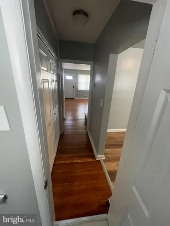 a kitchen with granite countertop a stove and a refrigerator