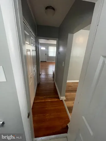 a kitchen with granite countertop a stove and a refrigerator
