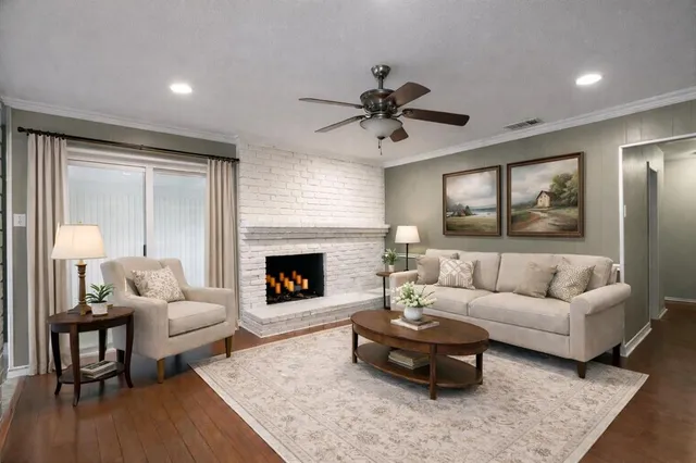 a living room with furniture and a fireplace