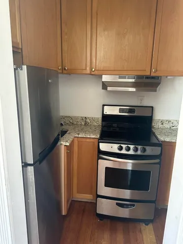 a kitchen with a stove and a refrigerator