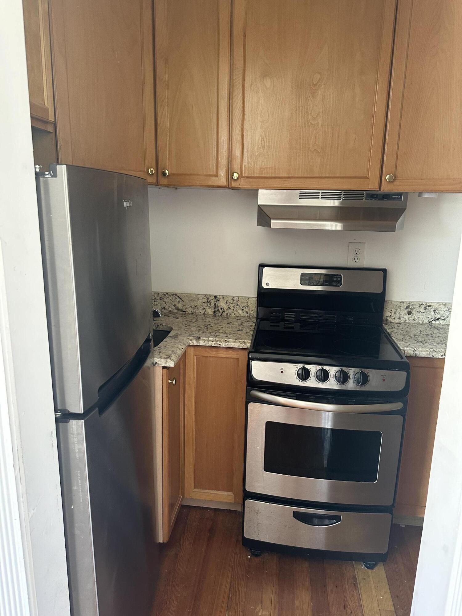 258 Seminole Avenue, Unit 4 Palm Beach, FL 33480 - Photo 7 of 10 a kitchen with a stove and a refrigerator