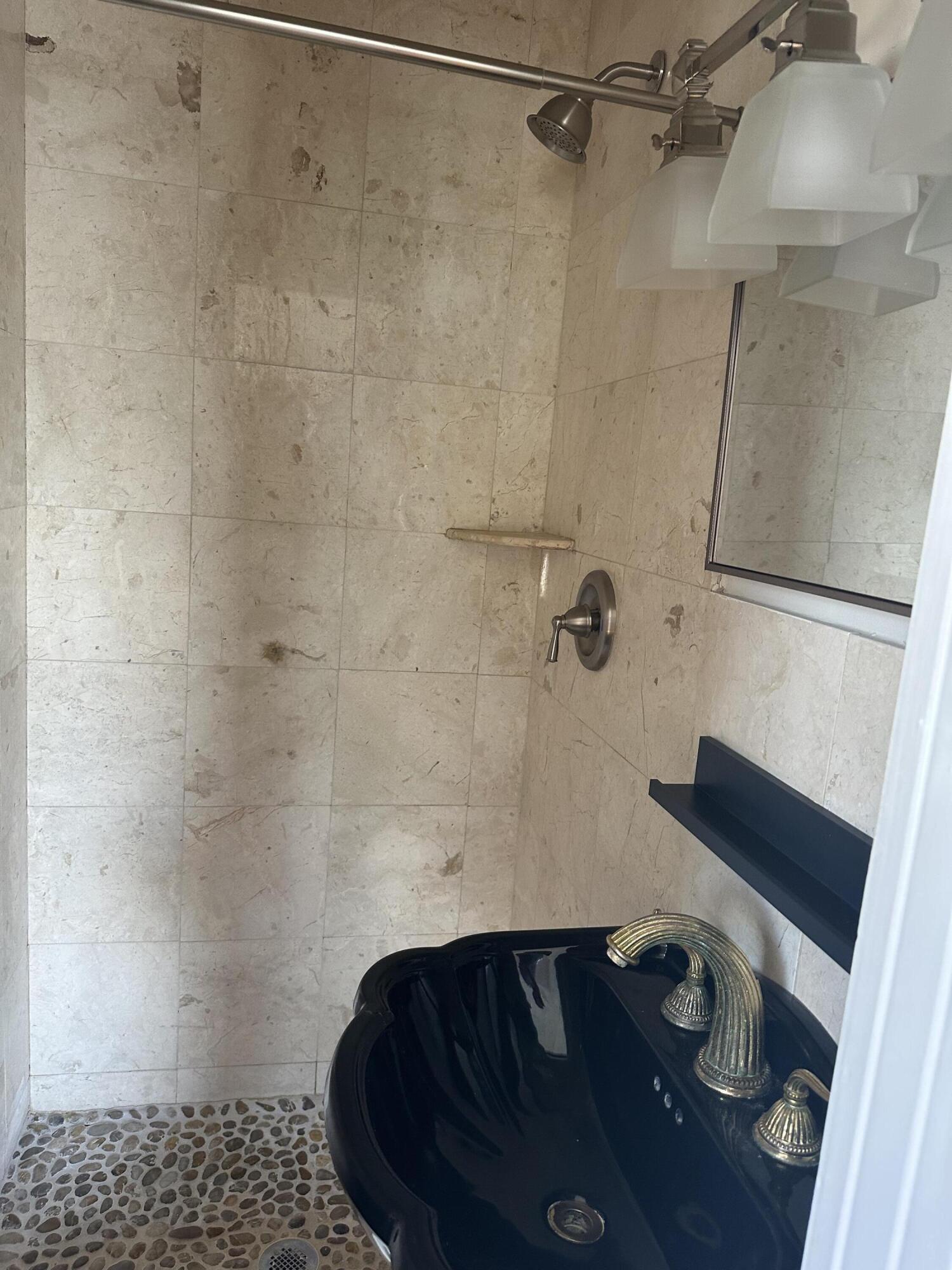 258 Seminole Avenue, Unit 4 Palm Beach, FL 33480 - Photo 9 of 10 a bathroom with a shower