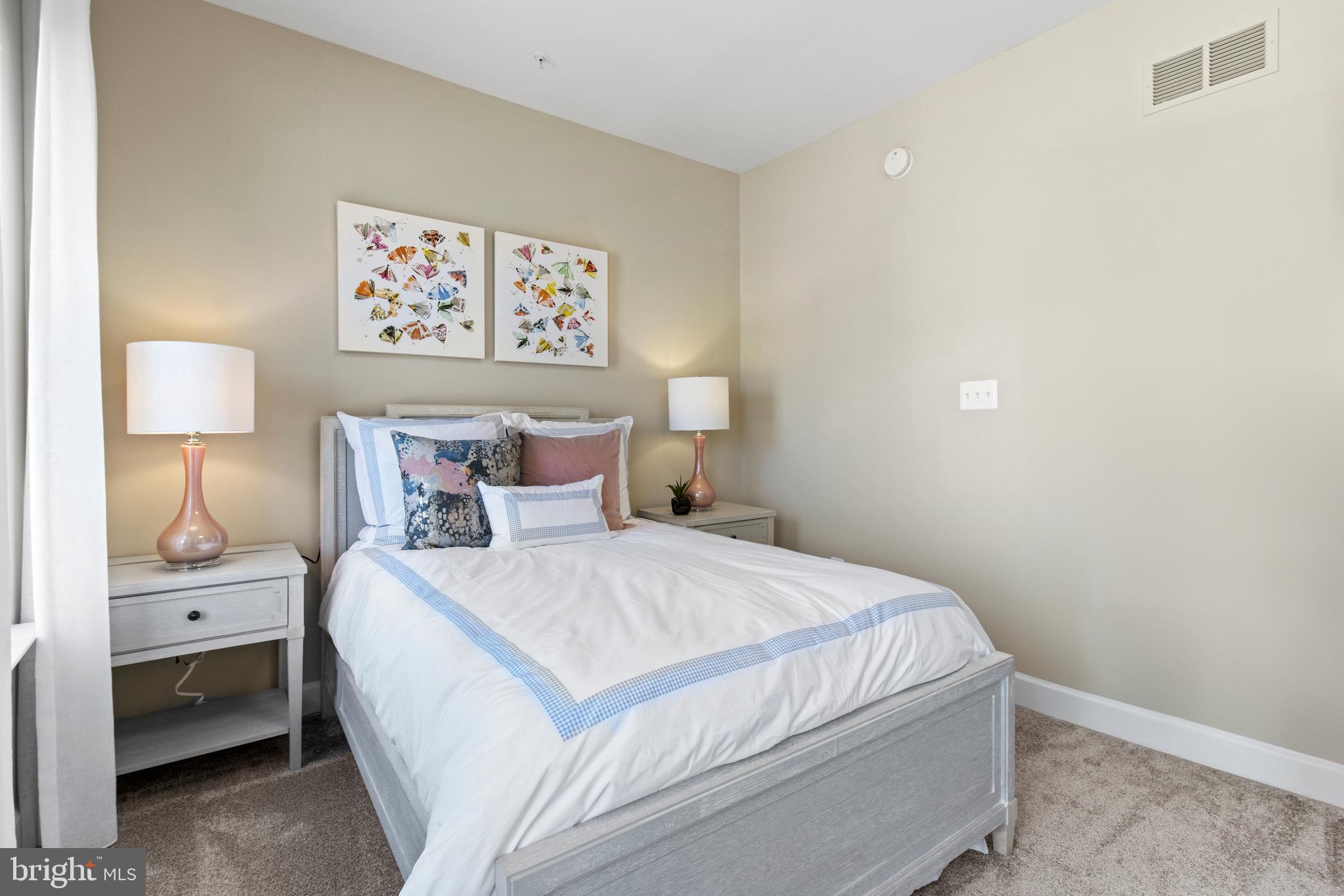 13750 Cobble Loop Woodbridge, VA 22193 - Photo 3 of 27 a bedroom with a bed and a lamp on dresser