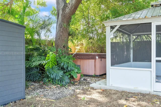 a view of a backyard with plants