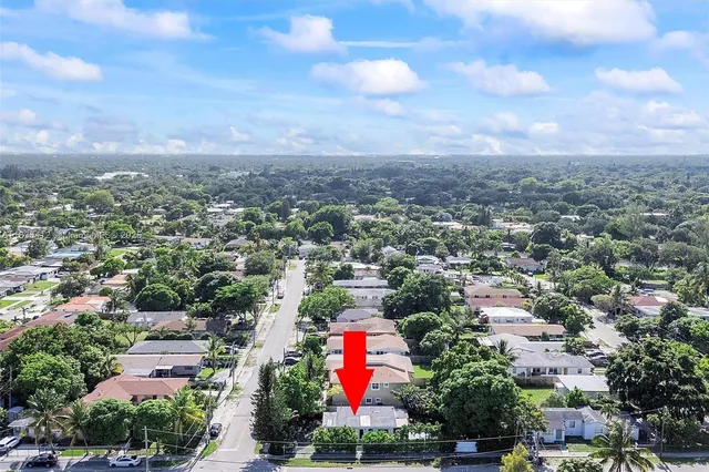 an aerial view of city and green space