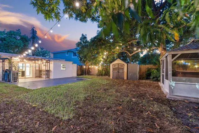 a front view of a house with a yard and a garage