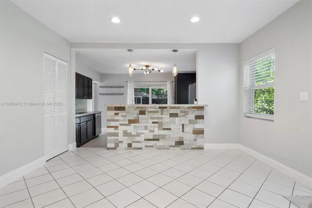 a view of kitchen with furniture and window