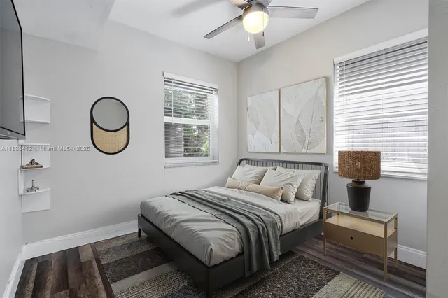 a bedroom with bed and a window