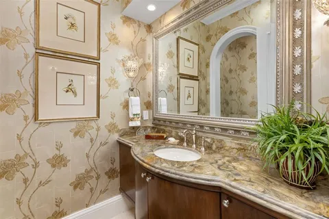 a large kitchen with a table and chairs