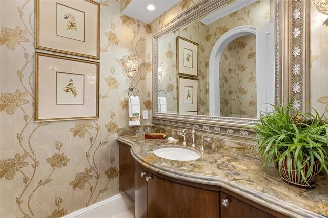 a large kitchen with a table and chairs