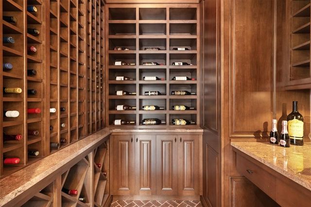 a bathroom with a granite countertop sink mirror vanity and toilet