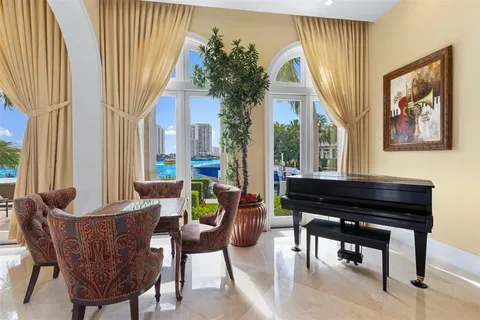 a bedroom with a bed couch and window