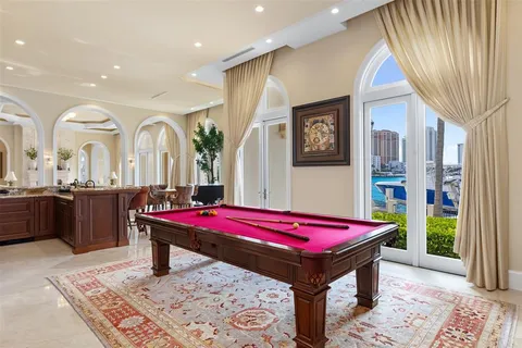 a bathroom with a granite countertop double sink and a mirror