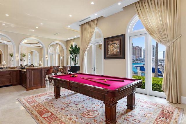 a bathroom with a granite countertop double sink and a mirror