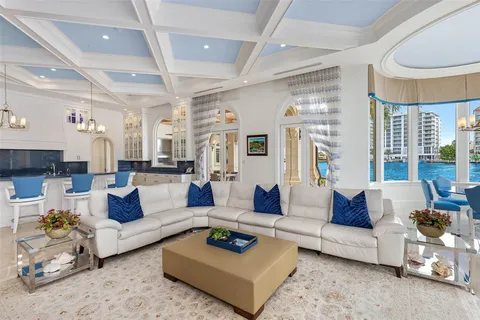 a living room with furniture and a large window with outer view