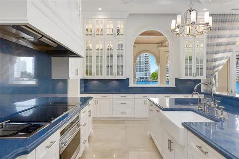 a living room with furniture and a large window with outer view