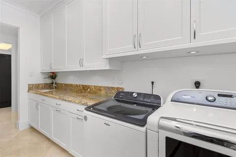 a view of swimming pool with outdoor seating and city view