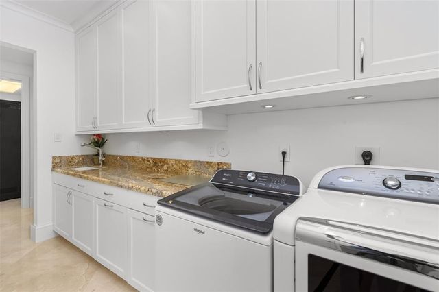 a view of swimming pool with outdoor seating and city view