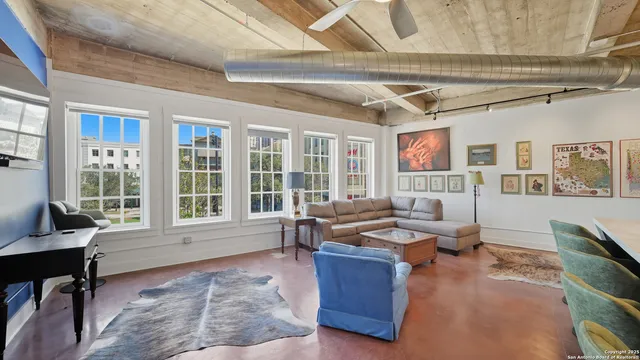 a work room with furniture and a window