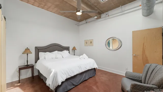 a bedroom with bed and window