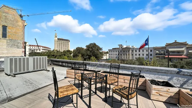 a view of a terrace with furniture