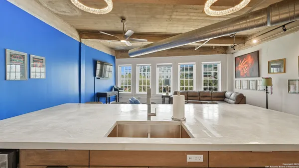 a view of a living room and kitchen