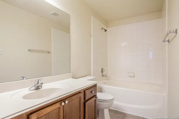 a bathroom with a sink a toilet and a bathtub