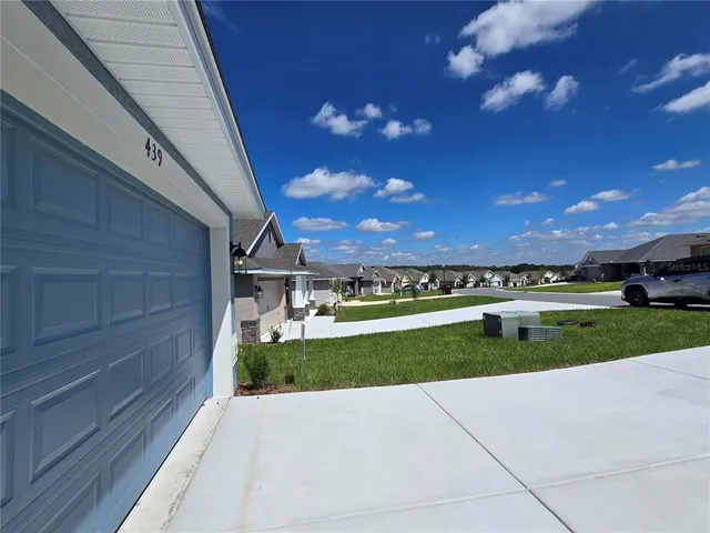 a view of a yard with a car park