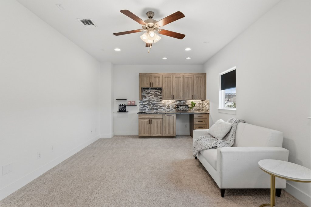 305 Avena Trail Austin, TX 78738 - Photo 11 of 40 Versatile media room offers flexibility for a home theater, game room, or secondary living space, with a convenient wet bar for easy entertaining.