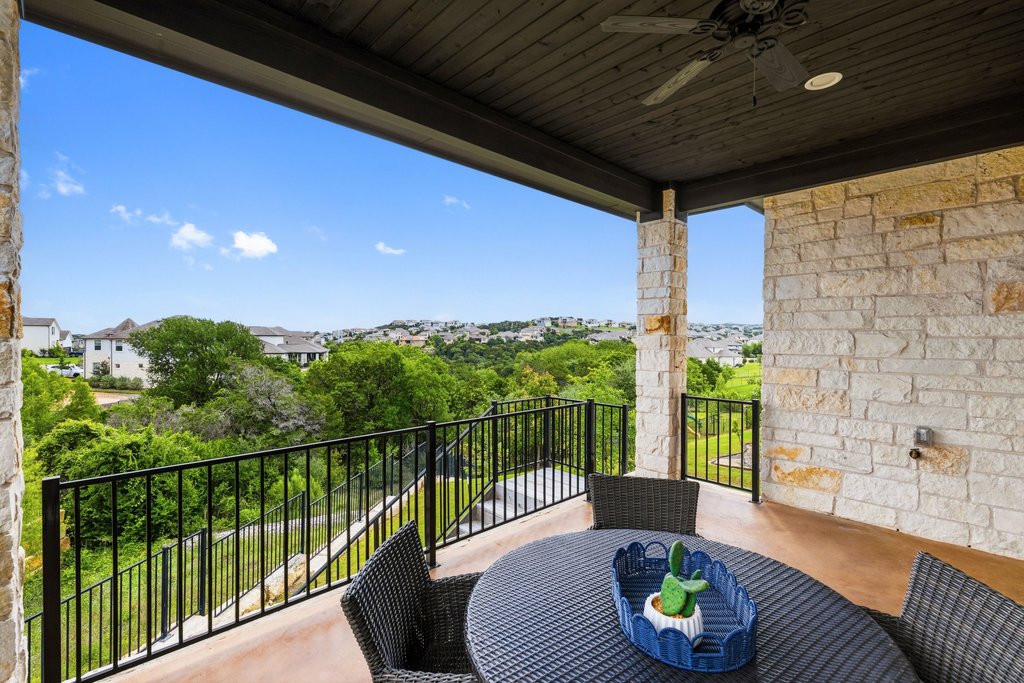 305 Avena Trail Austin, TX 78738 - Photo 12 of 40 a view of a chair and table in the balcony
