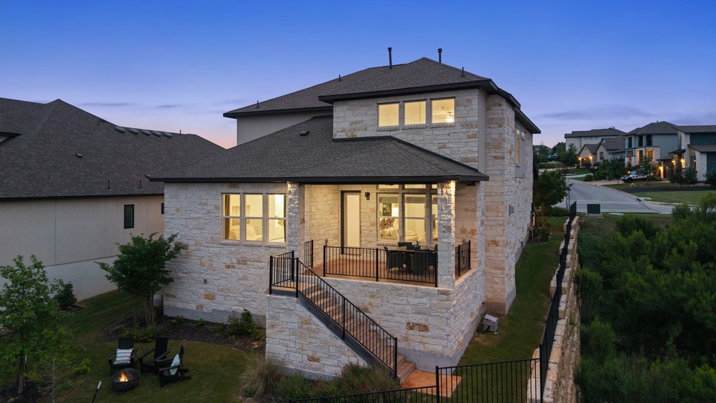 305 Avena Trail Austin, TX 78738 - Photo 14 of 40 a front view of a house with garden