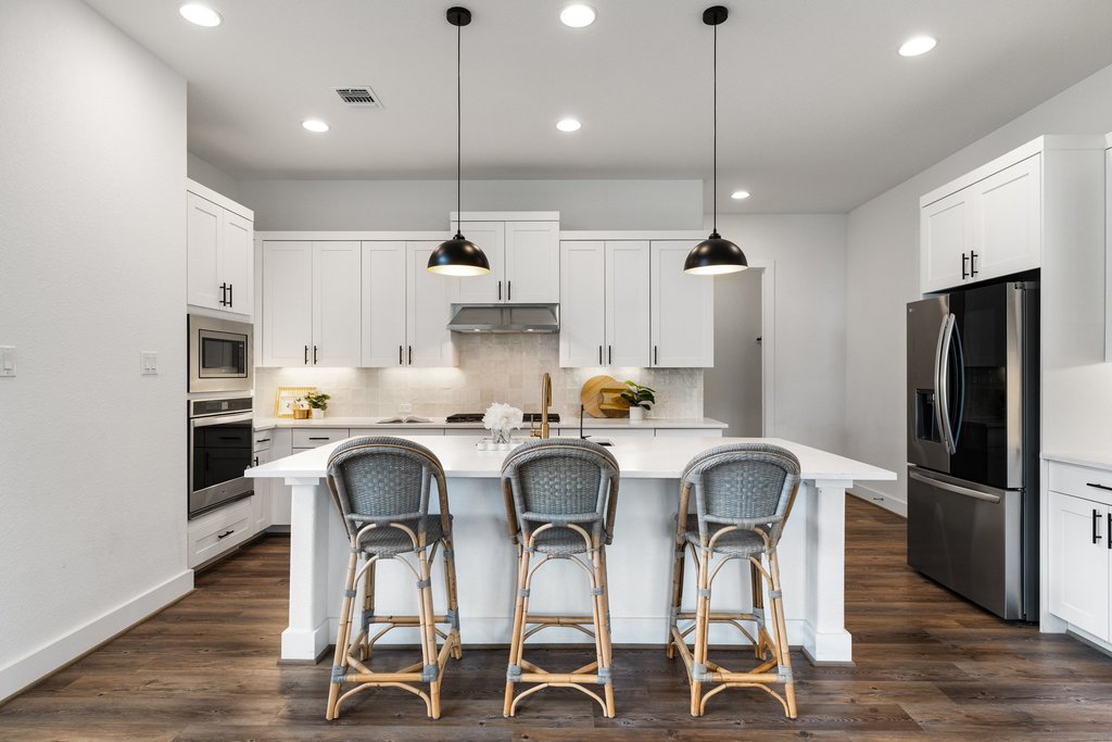 305 Avena Trail Austin, TX 78738 - Photo 2 of 40 Welcome to the heart of the home! Complete with designer tile backsplash, stainless appliances and an island for everyone to gather around.