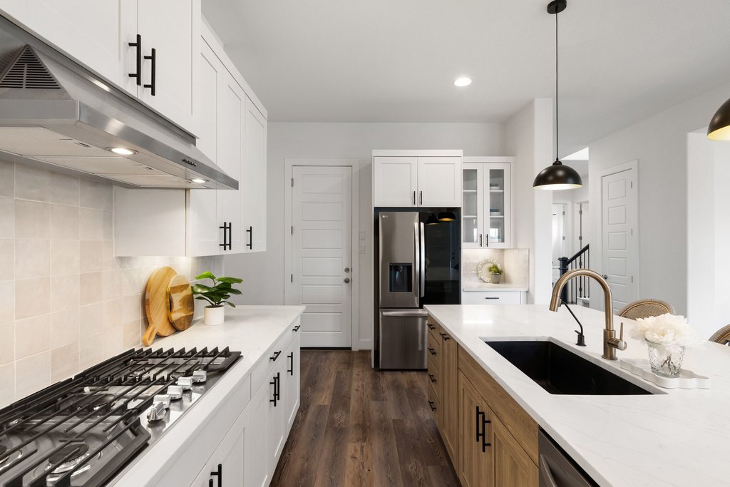 305 Avena Trail Austin, TX 78738 - Photo 22 of 40 a kitchen with a sink stove and refrigerator